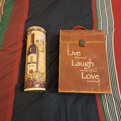 A pair of wine presentation boxes, one holds two bottles.