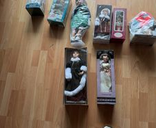 Selection of 8 beautiful porcelain and Victorian-style collectable dolls