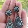 Vintage-style long bohemian drop earrings featuring turquoise enamel and a bronze-tone metal finish. Image 2