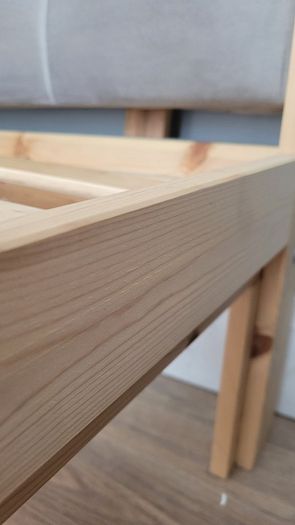 Single bed with cushioned headboard