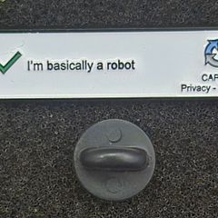 I'm basically a robot. pin back badge.