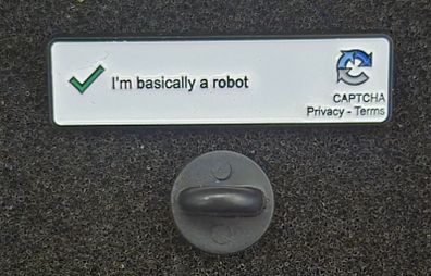 I'm basically a robot. pin back badge.