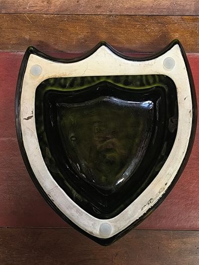 vintage Moet & Chandon shield-shaped ceramic advertising piece.