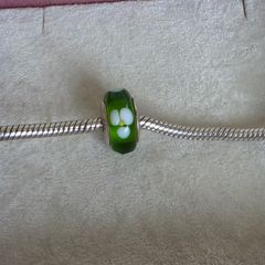 Pandora green glass charm with white flower design very good condition hallmarked