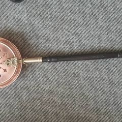brass and copper Victorian bed warmer .