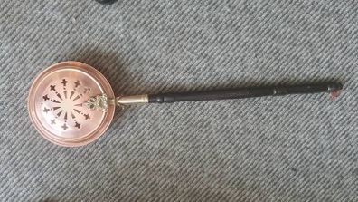 brass and copper Victorian bed warmer .
