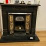 Late Victorian / early Edwardian style cast iron fireplace with tiled inserts and a decorative mantel surround Image 4