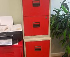 Red metal Ikea office cabinets