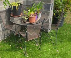 Wrought iron garden table and chairs