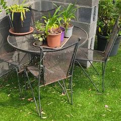 Wrought iron garden table and chairs