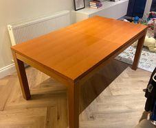 Extendable veneer wood dining table