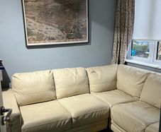 Cream leather corner sofa with right facing chaise