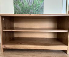 Small storage, shoe storage, tv stand. Very solid.