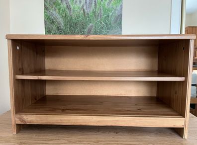 Small storage, shoe storage, tv stand. Very solid.