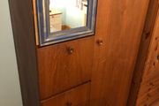 Wooden wardrobe with drop-down door and drawers