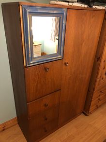 Wooden wardrobe with drop-down door and drawers