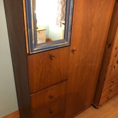 Wooden wardrobe with drop-down door and drawers
