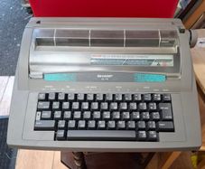 Sharp QL 110 Portable Electronic Typewriter, a vintage office machine from the late 1980s