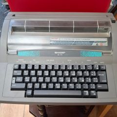 Sharp QL 110 Portable Electronic Typewriter, a vintage office machine from the late 1980s