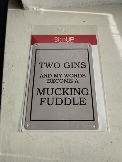 New in original packaging. Two gins and my words become a mucking fuddle sign