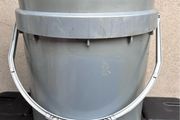 Tall grey plastic bucket