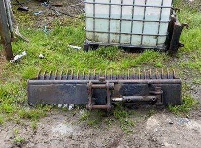 Tilt rake bucket
