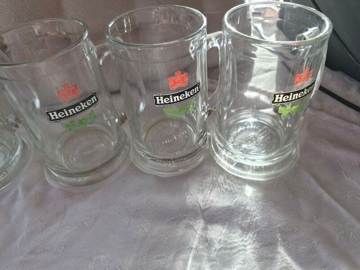 5 Vintage Heineken 1/2 pint, glass beer tankards/mugs.