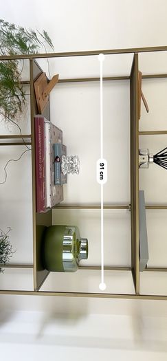 Brass effect shelf unit