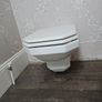 4 traditional style white ceramic toilets available for sale. Image 5