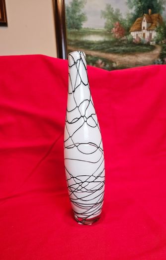 A decorative glass vase made of blown art glass, resembling a bottle in Murano style. Ornament