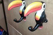 2 Guinness  toucan cast iron  coat hangers