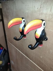 2 Guinness  toucan cast iron  coat hangers
