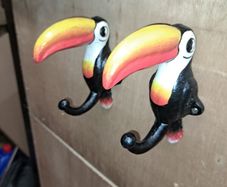 2 Guinness  toucan cast iron  coat hangers