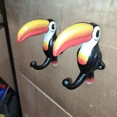 2 Guinness  toucan cast iron  coat hangers