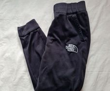 The North face thick polyester bottoms Size small 28" leg black In excellent condition