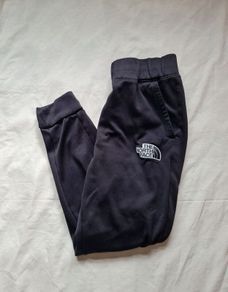 The North face thick polyester bottoms Size small 28" leg black In excellent condition