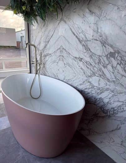 Freestanding stone bath