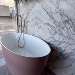 Freestanding stone bath