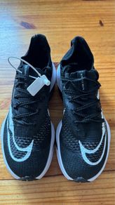 Nike Air Zoom Alphafly NEXT% 2 marathon racing shoes in black and white.
