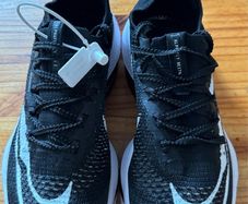 Nike Air Zoom Alphafly NEXT% 2 marathon racing shoes in black and white.