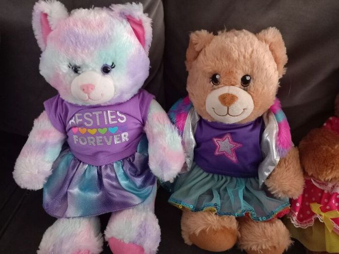 Build a Bear x 4 with outfits on.