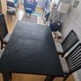 Black dining table with four chairs Image 5