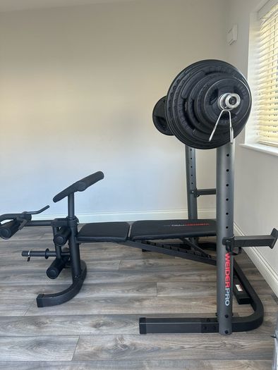 Home Gym Equipment: Adjustable Weider Gym Bench, Olympic bars, and Rubber Weights