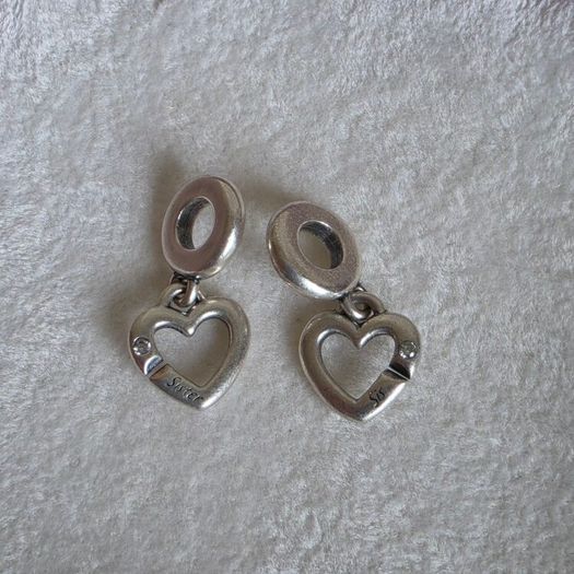 Pandora linked sister hearts split dangle charm. Very good condition hallmarked