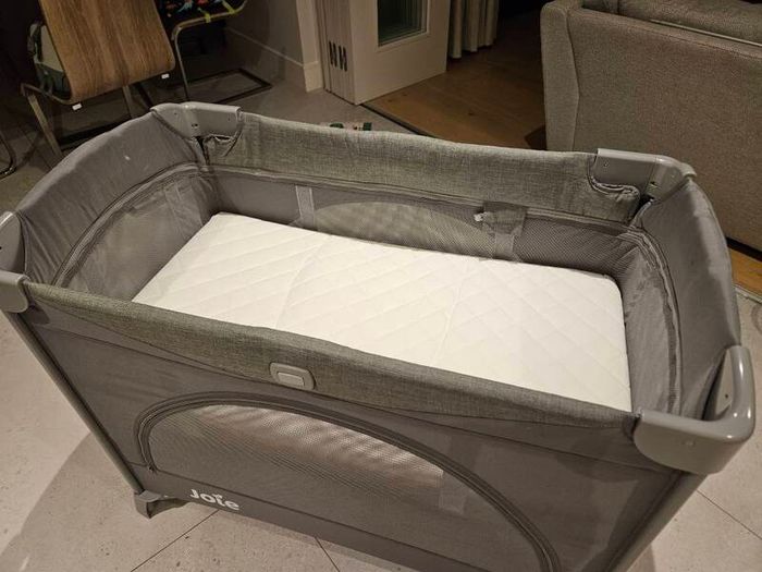 Joie travel cot with bassinet and extra mattress