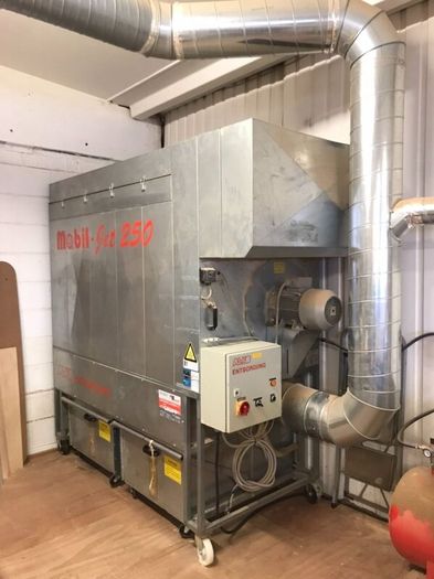 Dust extraction system for woodworking machinery