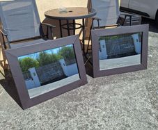 Pair of leather framed mirrors