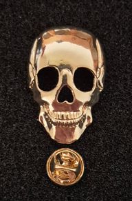 Skull,  pin back badge.