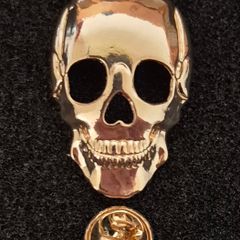 Skull,  pin back badge.