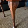 Vintage Queen Anne-style wooden coffee table featuring cabriole legs, a glass top protecting an inset leather surface with gold tooling Image 2